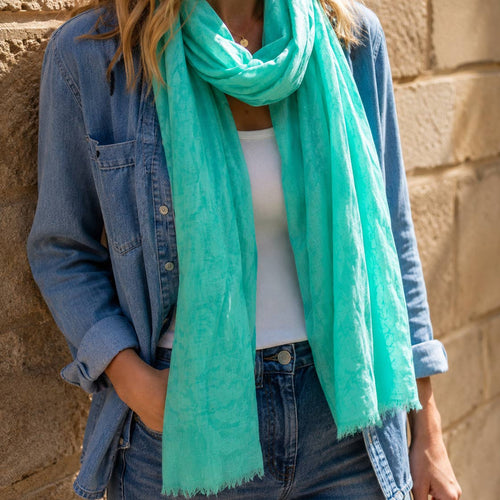 Fresh aqua green bird print scarf bringing a gorgeous splash of colour to a relaxed denim look.