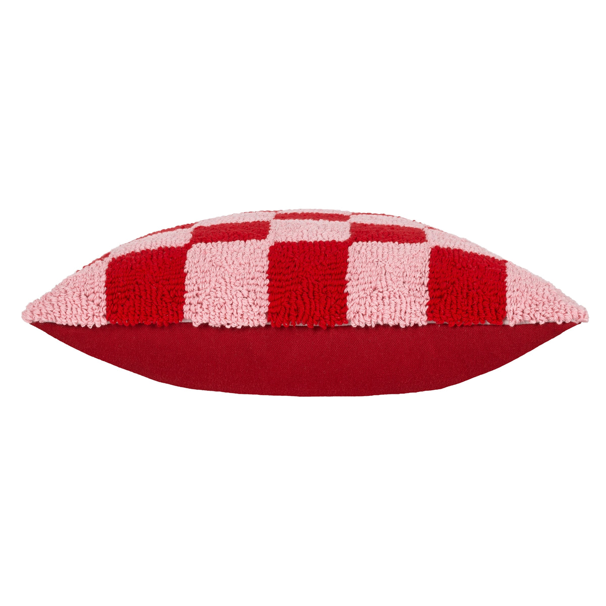 Side view of pink and red checkerboard tufted cushion showing its contrasting red reverse.
