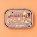 Gingerbread soy wax candle in a pink pull ring tin with festive illustrations on a soft peach background.