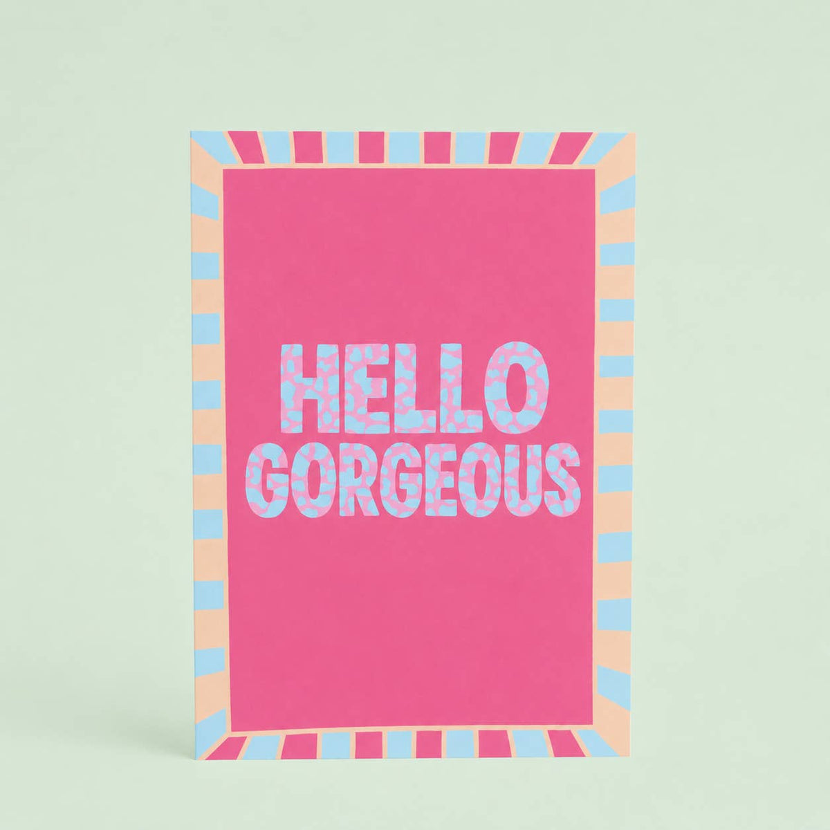 Bright Hello Gorgeous A5 art print with patterned blue lettering, a vivid pink centre and colourful retro striped border.