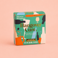 Box of eight Hangover Cure shower steamers scented with eucalyptus and peppermint in colourful green and orange packaging on a peach background.