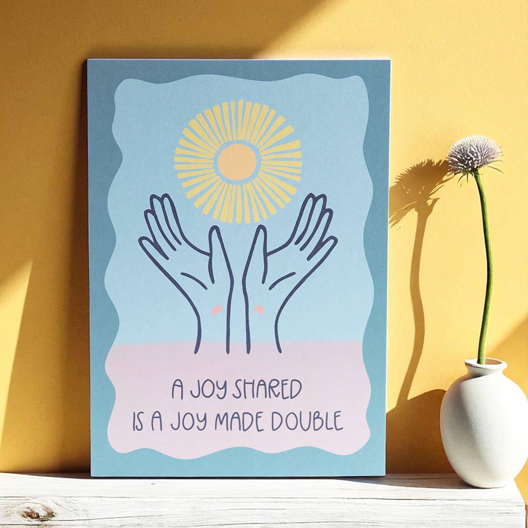 Joyful A5 art print with open hands, a yellow sun and the words “A Joy Shared Is A Joy Made Double” in soft pastel colours.