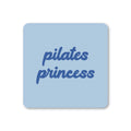 Pale blue square coaster with rounded corners and blue script reading Pilates Princess.