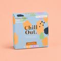 Box of eight Chill Out shower steamers scented with vanilla, jasmine and valerian in colourful blue packaging on a peach background.
