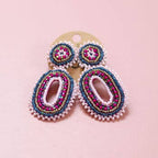 Pink and blue beaded oval statement earrings displayed as a pair on a jewellery card.