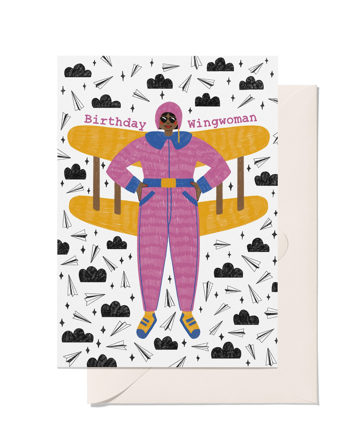 Birthday Wingwoman greeting card with illustrated woman in a pink flying suit, yellow plane wings and playful paper plane pattern.