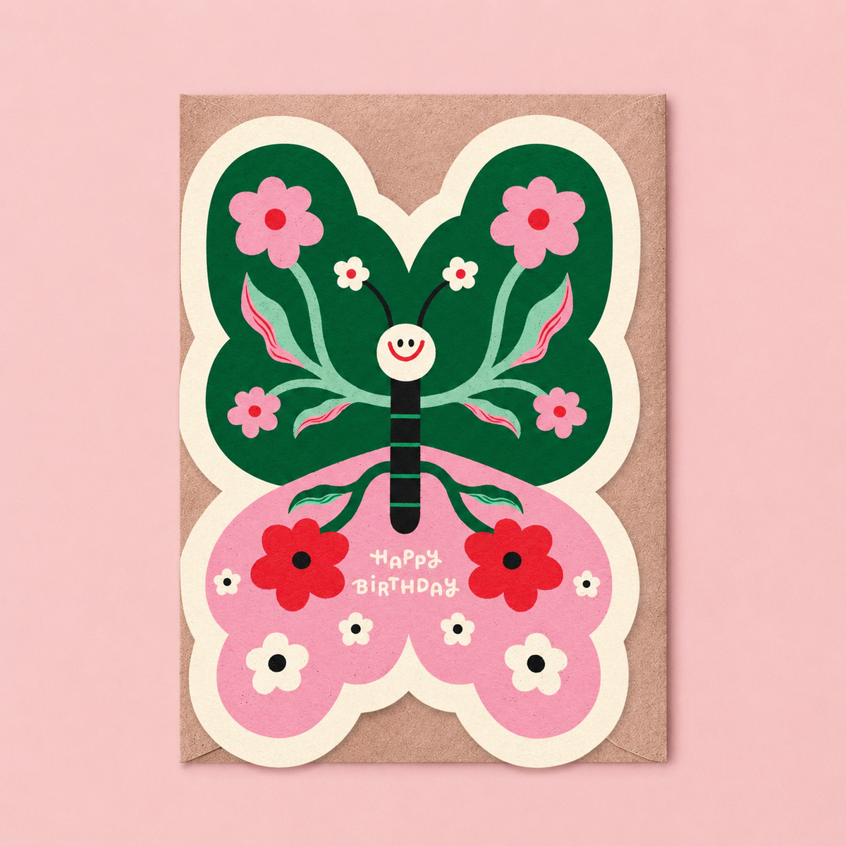 Colourful butterfly shaped birthday card in pink and green with floral details, smiling face and Happy Birthday message.