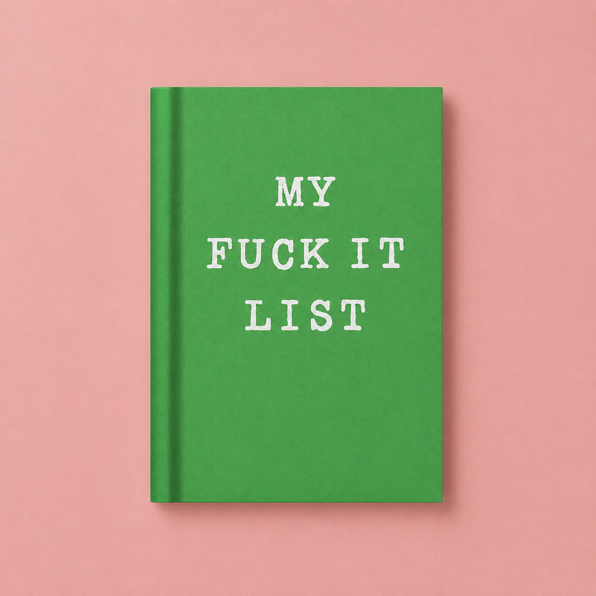 Bright green A7 fabric hardback notebook with white My Fuck It List lettering on a pale pink background.