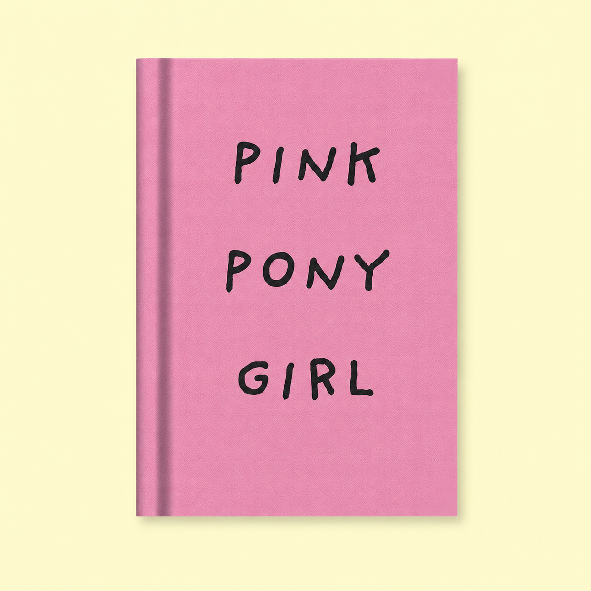 Pink A7 fabric hardback notebook with black Pink Pony Girl lettering on a soft pale yellow background.