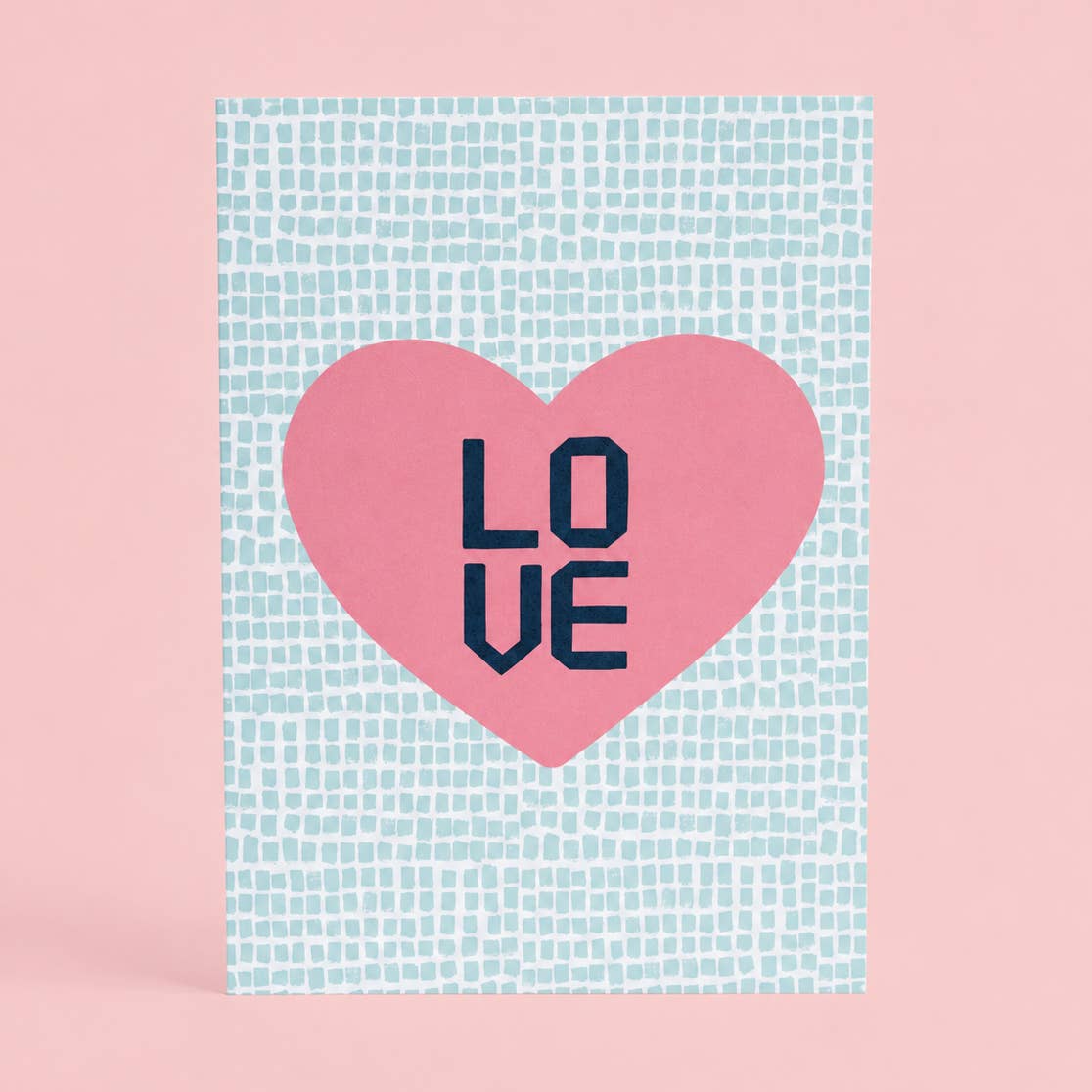 Colourful LOVE A5 art print with a large pink heart and navy lettering against a fresh mint patterned background.