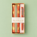 Terracotta sun print vegan leather pencil pouch and matching pen presented together in a gift box.