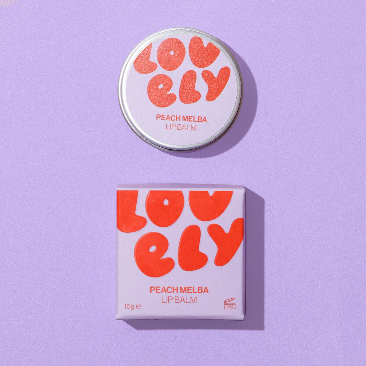 Peach Melba Lip Balm 10g tin and lilac and orange box on a lilac background