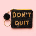 Black beaded mini keyring purse with gold ‘DON’T QUIT’ lettering, black pom pom and gold tone keyring.