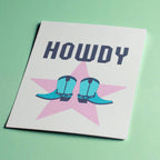 Howdy A5 art print with bold navy lettering, turquoise cowboy boots and a soft pink star on a cream background.