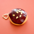 Chocolate doughnut bag charm keyring with glossy dark chocolate icing, almond style sprinkles and gold heart shaped clip.