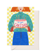It’s Your Cake Day birthday card featuring a pink iced sprinkle cake with candles against a bright yellow checked background.
