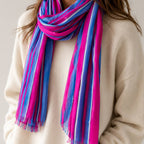Fabulous pink and blue striped scarf bringing a bold burst of colour to a cosy cream jumper.