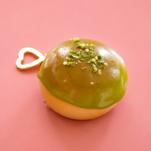 Apple glaze doughnut bag charm keyring with glossy green icing, sprinkle details and gold heart shaped clip.