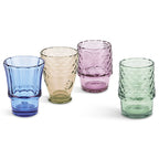 Four multicoloured fish drinking glasses in blue, amber, purple and green displayed separately.
