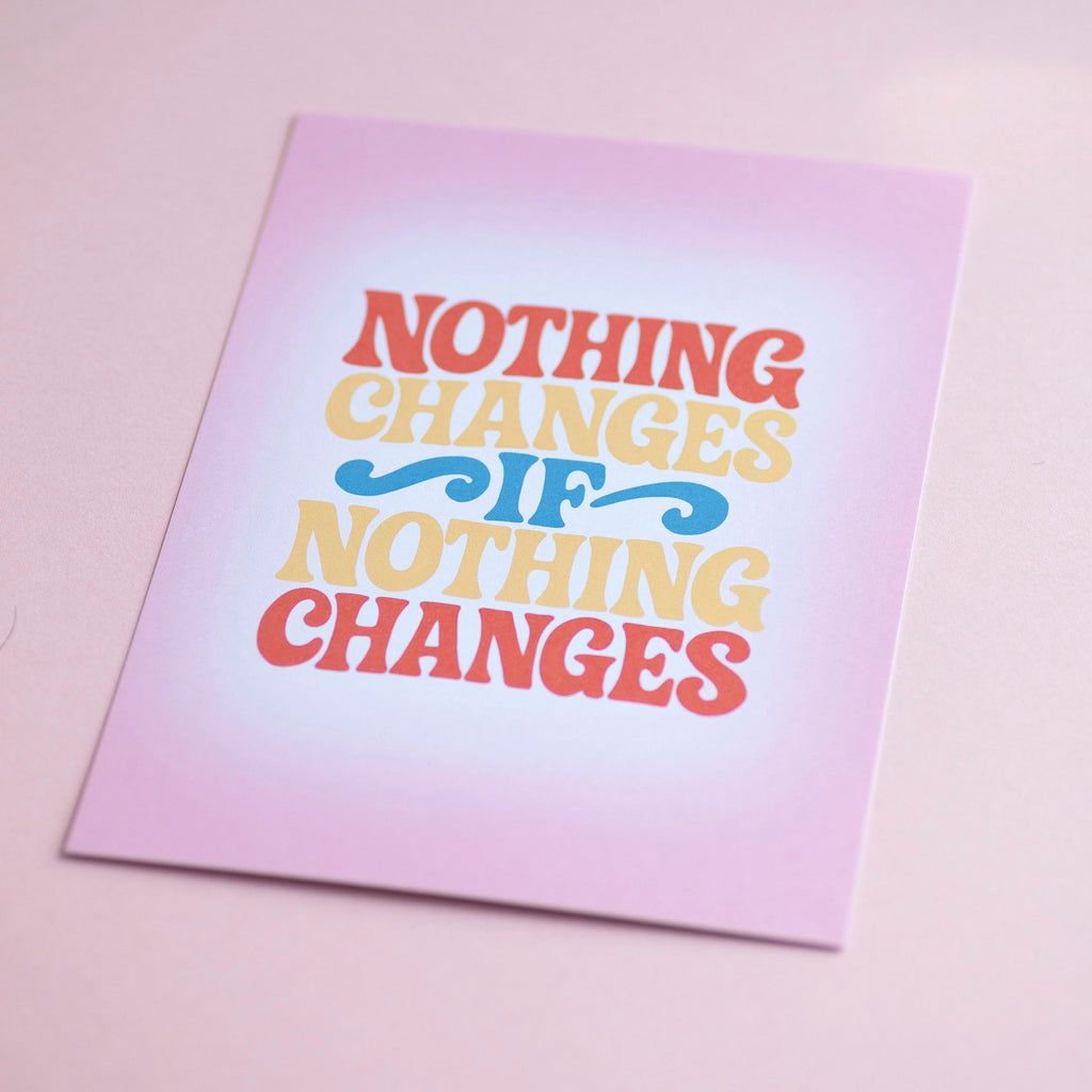 Joyful Nothing Changes If Nothing Changes A5 print with colourful retro lettering, photographed against a soft pink background.