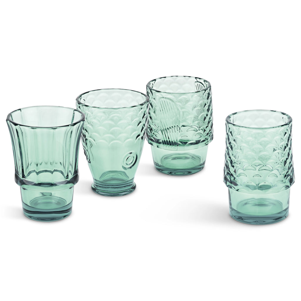 Set of four green fish shaped drinking glasses displayed separately on a white background.