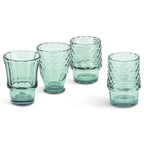 Set of four green fish shaped drinking glasses displayed separately on a white background.