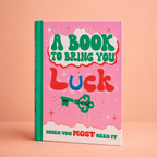 A Book to Bring You Luck colourful hardback gift book with bright pink and green cover, horseshoe and lucky key.