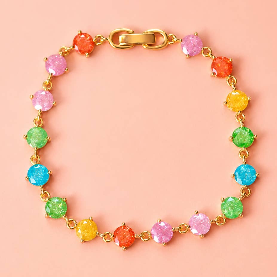 Rainbow frosted crystal bracelet with pink, orange, yellow, green and blue stones in a gold tone setting.