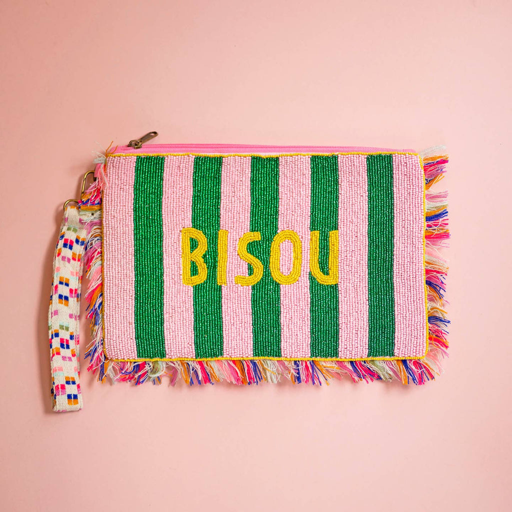 Pink and green striped beaded clutch bag with yellow Bisou lettering, colourful fringe and patterned wrist strap.