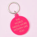 Hot pink round statement keyring with gold The World Needs More Women Like You lettering and silver-tone keyring.