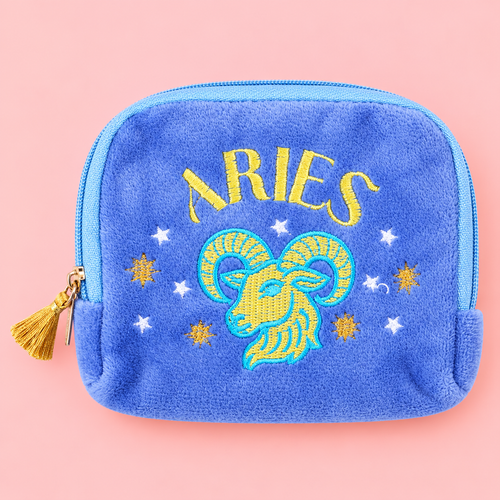 Bright blue velvet Aries zodiac pouch with yellow and turquoise embroidered ram, stars and gold tassel zip.