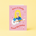 Pink Dolly Parton inspired birthday card featuring a blonde singer with guitar and Have A Dolly Good Birthday message.