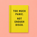 Bright yellow A7 fabric hardback notebook with black Too Much Panic Not Enough Disco text on a peach background.