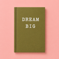 Olive green A7 hardback notebook with white Dream Big lettering on a pale pink background.