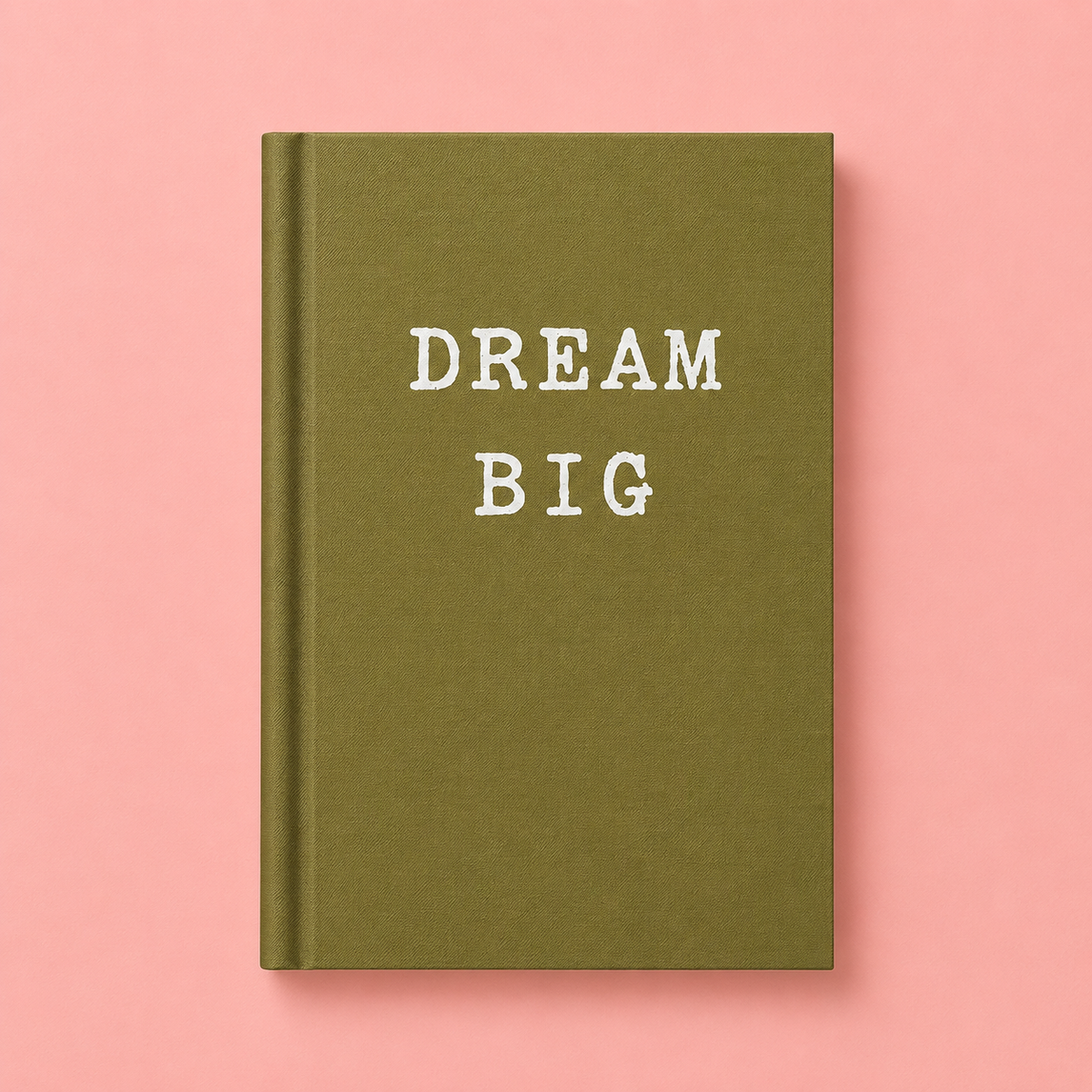 Olive green A7 hardback notebook with white Dream Big lettering on a pale pink background.