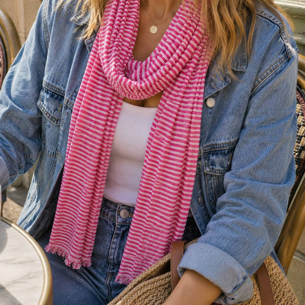Bright pink and white striped scarf adding a fabulous pop of colour to a relaxed denim outfit.