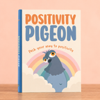 Positivity Pigeon colourful hardback gift book with rainbow and illustrated blue pigeon on the cover.