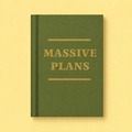 Olive green A7 fabric hardback notebook with gold Massive Plans lettering on a soft yellow background.
