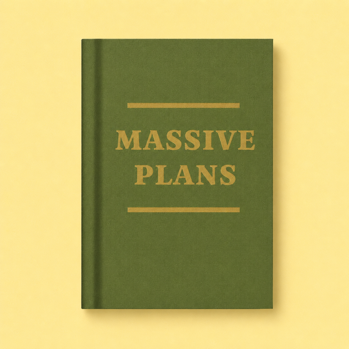 Olive green A7 fabric hardback notebook with gold Massive Plans lettering on a soft yellow background.