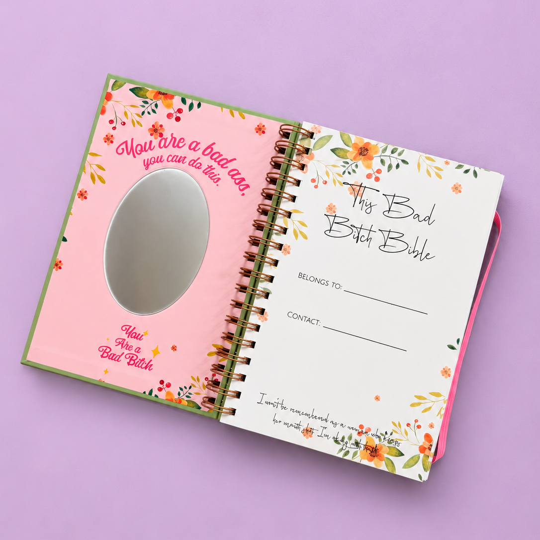 Open Bad Bitch Bible daily planner showing floral inside cover with mirror and belongs to page.