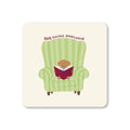 Cream square coaster featuring a small dog reading a book in a green striped armchair with BRB Going Analogue above.