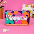 Colourful Understand & Embrace Your Menopause card set in bright pink, orange, green and purple packaging.