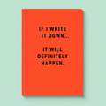 Bright orange A5 notebook with black text reading If I write it down it will definitely happen.