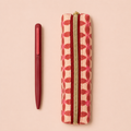 Pink vintage floral vegan leather pencil pouch with gold coloured zip and coordinating pink pen presented together i