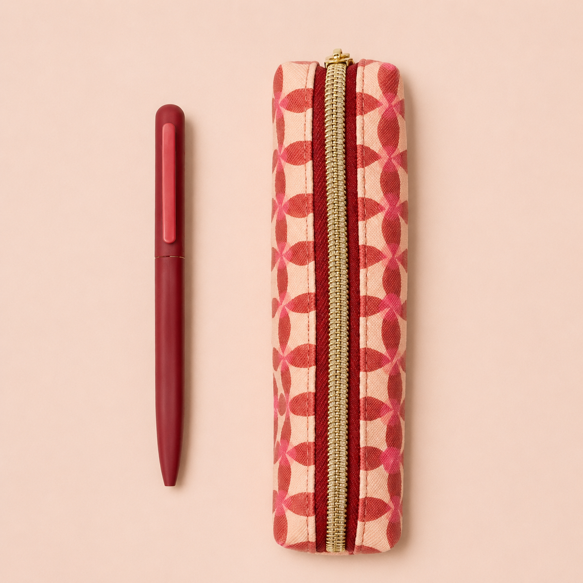 Pink vintage floral vegan leather pencil pouch with gold coloured zip and coordinating pink pen presented together i