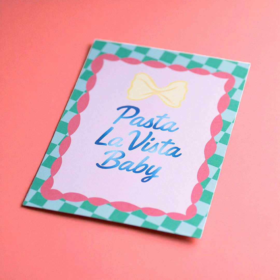 Colourful Pasta La Vista Baby A5 print with gingham border and bow pasta illustration on a bright coral pink background.