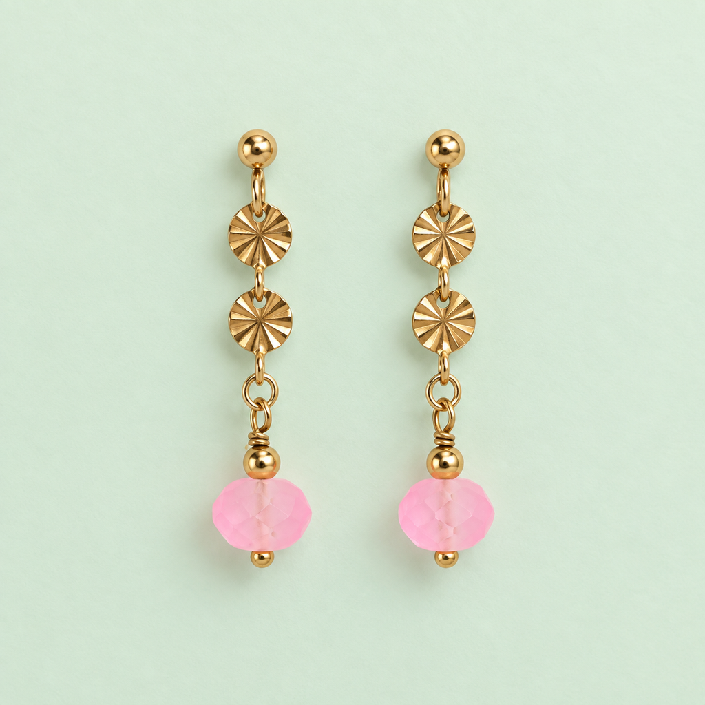 Pair of limited edition gold plated drop earrings with textured discs and frosted neon pink faceted glass beads on pale mint background.