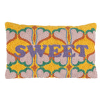 Yellow woven loop cotton cushion with pink hearts, green details and lilac SWEET lettering.