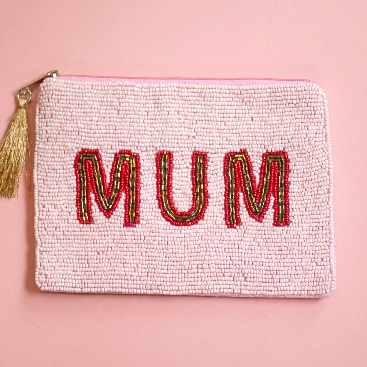 Pink beaded zip pouch with large red and gold ‘MUM’ lettering and gold tassel zip pull.