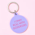 Lilac round statement keyring with pink I Only Roll With Goddesses lettering and silver-tone metal keyring attachment.

